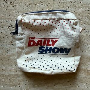 NWOT official The Daily Show Canvas Zippered Pouch: Cream with Red, Blue Accents
